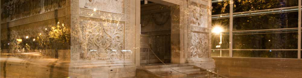 View of Ara pacis with night lights reflected from outside 